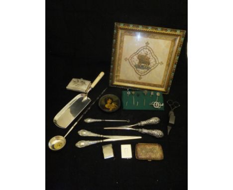 A box containing various silver and gold and other tie pins, together with a brooch in the form of a whip with two horseshoes