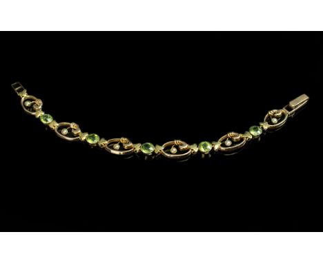 Edwardian Period 1902 - 1910 Attractive Well Designed 15ct Gold Peridot and Seed Pearl Set Bracelet. Marked 15ct. Peridots of