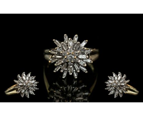 A 9ct Diamond Cluster Ring, set with round brilliant and baguette cut diamonds, in a flower head setting.  Fully hallmarked. 