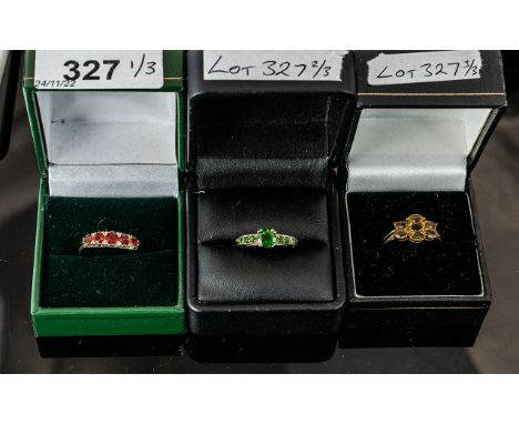 Three 9ct Gold Dress Rings, set with Citrine, Garnet and green Tourmaline coloured stones.  Green stone set ring missing a sm