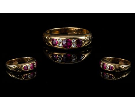 Antique Period Attractive Ladies Three Stone Ruby and Diamond Set Ring, marked 18ct to interior of shank; the natural rubies 