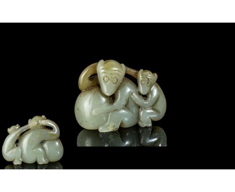 A Small Jade Carving Depicting Two Monkeys 2 inches long.