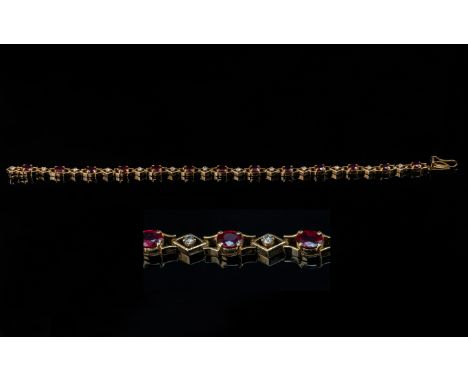 18ct Gold - Good Quality Ladies Ruby and Diamond Set Bracelet. Marked 18ct. Rubies and Diamonds of Good Colour / Clarity. Set