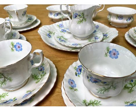 Richmond Bone China 'Blue Poppy' Tea Service, comprising a milk jug, two sugar bowls, seven teacups, six saucers, six side pl