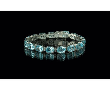 Blue Topaz Tennis Bracelet, a stunning 37cts of oval cut, clear, sparkling blue topaz set in a single row in platinum vermeil