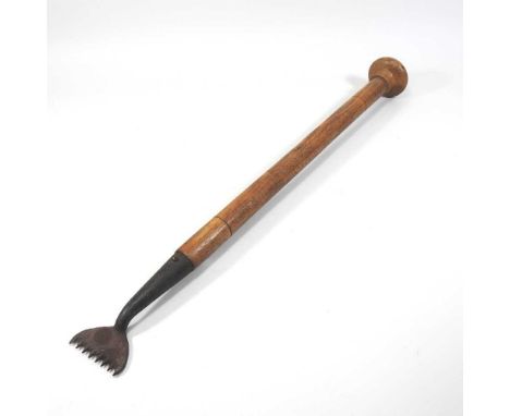 An early 20th century thatcher's tool, with a turned wooden handle64cm long