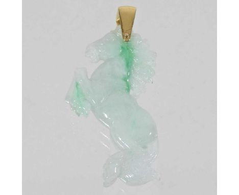 A carved jade coloured hardstone pendant, in the form of a leaping horse, with an unmarked gilt mount, 6cm high