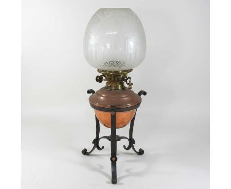 An early 20th century copper and brass oil lamp, with an etched glass shade50cm highCondition report: Looks to be complete. D