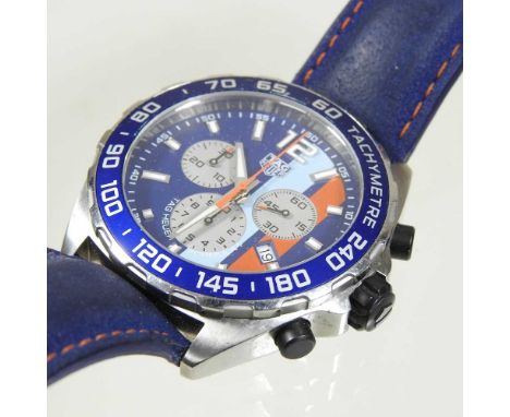 A modern Tag Heuer gentleman's Formula 1 Gulf steel cased chronometer wristwatch, with a signed coloured dial, on a blue leat