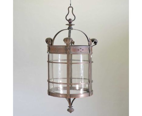 A large Arts and Crafts copper lantern, circa 1900, with scrolled decoration and clear glass insert, stamped F &amp; S60cm hi