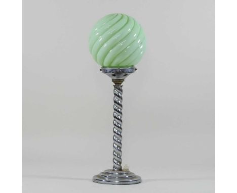 An Art Deco chrome table lamp, circa 1930, of twisted design, with a green opaque glass shade43cm high