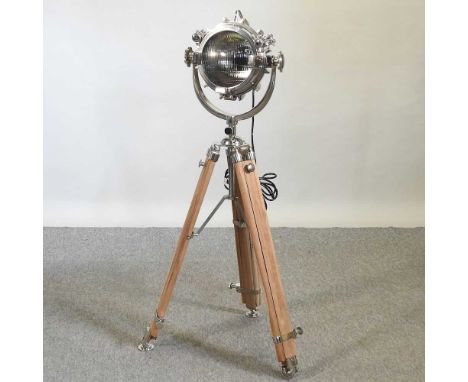A modern spotlight standard lamp, on an adjustable teak stand