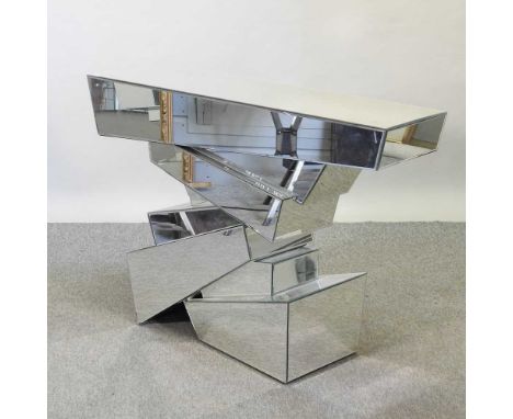 A modern mirrored console table, on a geometric stacked base120w x 33d x 79h cm