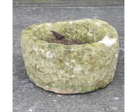 A reconstituted stone garden planter, of circular shape52cm diameter