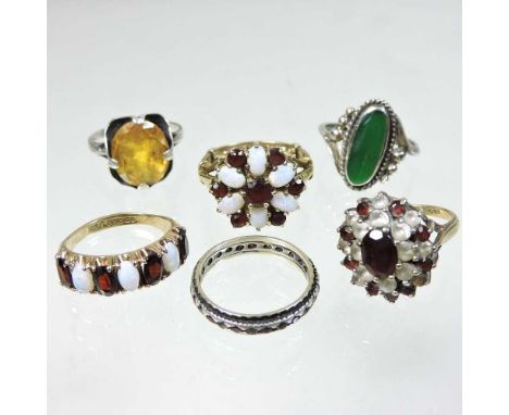 A 9 carat gold garnet and opal cluster ring, size K, together with another, a half hoop eternity ring and three various dress