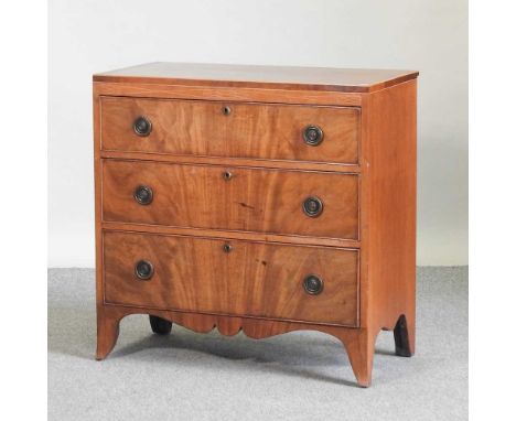 A 19th century mahogany and crossbanded chest, containing three drawers, on swept bracket feet77w x 41d x 77h cm