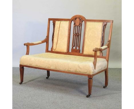 An Edwardian walnut and inlaid salon sofa, with gold upholstery116w x 56d x 101h cm
