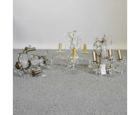 A cream painted three branch chandelier, with glass drops, 38cm diameter, together with two gold painted chandeliers with gla