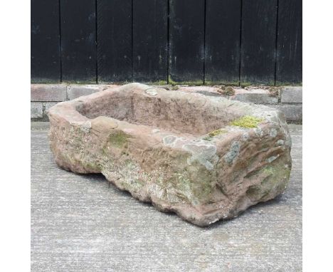 A large carved stone trough83w x 45d x 30h cm