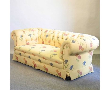 An early 20th century chesterfield sofa, with yellow floral upholstery210w x 100d x 76h cmCondition report: Overall is solid 