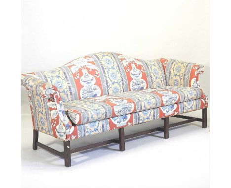 A George III style floral upholstered hump back sofa, with scrolled arms, on square legs218cmCondition report: Overall is sol