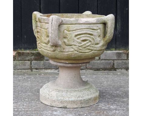 A Celtic style reconstituted stone planter, on a pedestal base, after a design by Archibald Knox, stamped Liberty53cm high ov