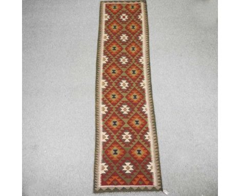 A kelim runner, with all over diamond design298 x 80cm
