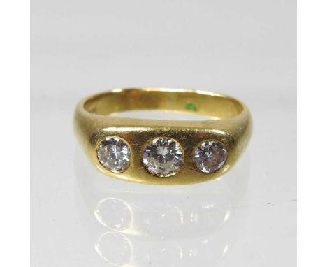 An 18 carat gold three stone diamond ring, approximately 0.8 carats gross, 8.9g, size SCondition report: The stones appear wh