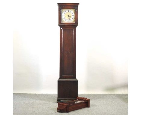A modern oak cased granddaughter clock, with a brass dial, together with a modern wall clock, in a glazed case (2)Granddaught