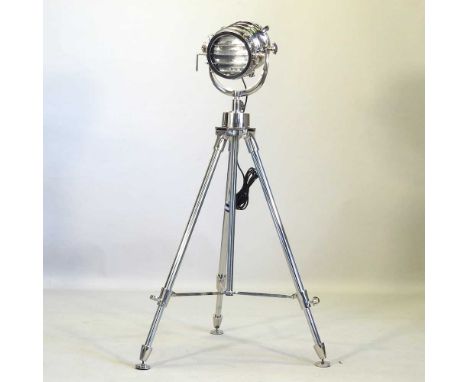 A modern spotlight standard lamp, on an adjustable tripod steel stand134cm high