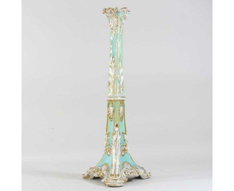 A 19th century Rockingham style porcelain table lamp base, of triangular shape, with gilt scrolled decoration and a weighted 