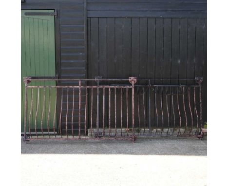 A black painted balcony railing, with flower baskets, together with a similar railing (2)Each 210w x 123h cm