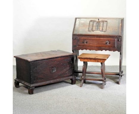 An early 20th century oak blanket box, carved with a ship, on carved bracket feet, together with an early 20th century carved