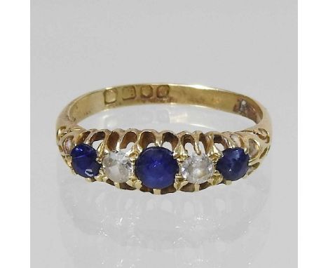 An 18 carat gold five stone sapphire and diamond ring, set with a single row of graduated stones, size P/Q, 3.7g