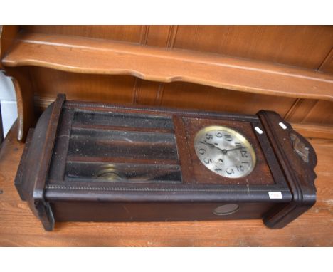 An early 20th Century mahogany cased wall clock