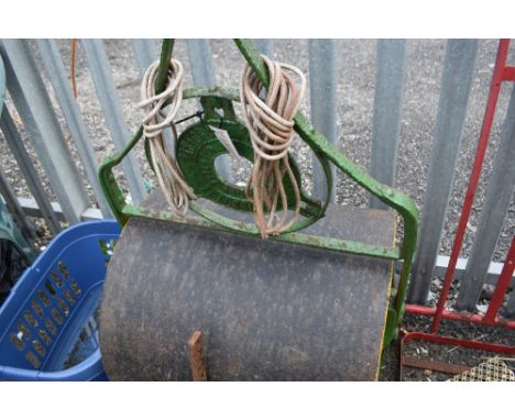 A large Victorian garden roller and similar.