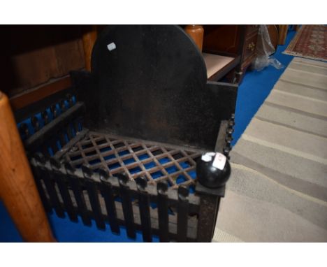 A vintage cast iron fire grate for inglenook.