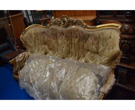 An 19th century high Victorian button back sofa having carved foliate gilt wood frame in good condition with original upholst