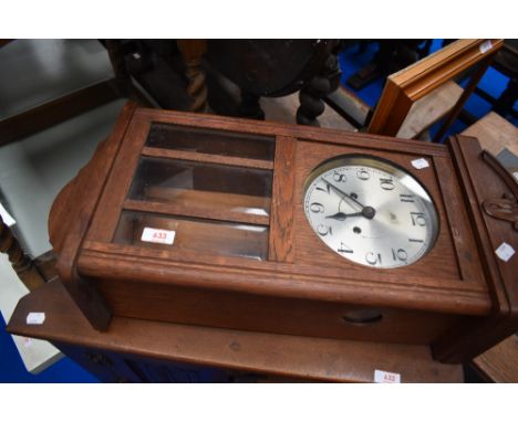 An early 20th Century oak cased wall clock, silvered dial stamped Haller A.G.