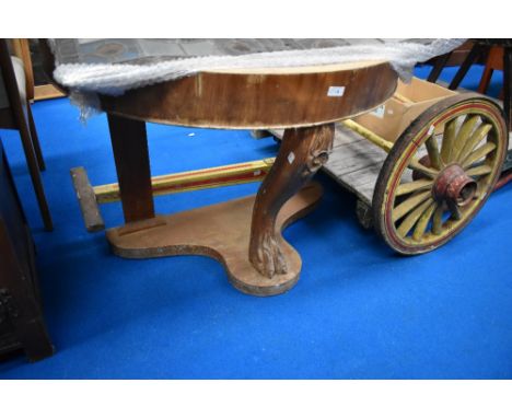 A Victorian console table stand in the form of a lions foot missing its top.