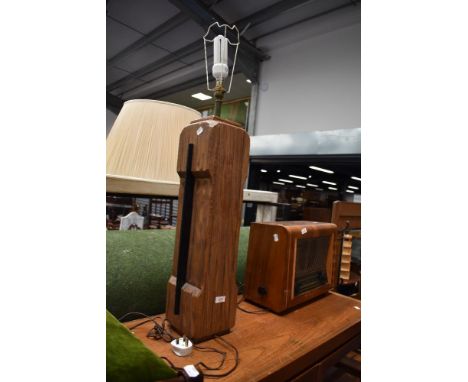 A substantial wooden lamp base aprox 70cm tall.