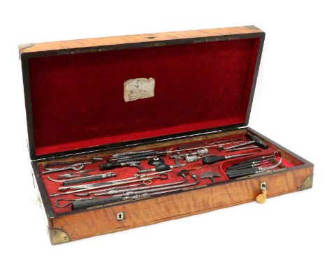 SURGEON'S TOOLS,mid-19th century, likely French, a campaign medical instruments set, in a flamed maple case with brass mounts