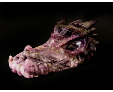 AMETHYST DRAGON SKULL,20th century, Brazil, an amethyst geode, hand-carved into the shape of a dragon's skull,22cm longCondit