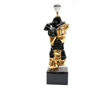 A SURREALIST LAMP,1950s, Italy, a table lamp in the form of a surrealist torso, partially gilt ceramic, executed in the manne