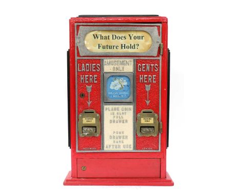 'WHAT DOES YOUR FUTURE HOLD?',20th century, a coin-operated fortune ticket machine, red-lacquered metal with a glass front in