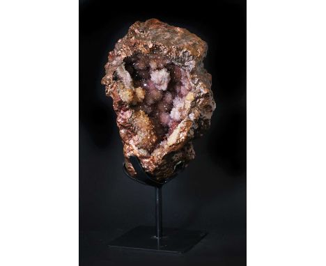COPPER-COATED RED AMETHYST GEODE,20th century, exterior with high polish, mounted on a metal stand, 40cm high overallThe red 