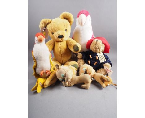 A Merrythought Teddy bear, a Paddington bear, two parrot soft toys and others 