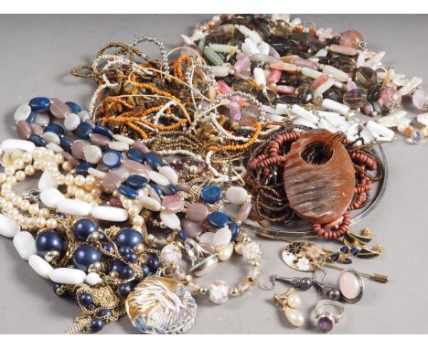 A quantity of costume jewellery, including stick pins, beaded necklaces, pendants and other items 