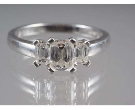 A platinum and diamond three-stone dress ring, size 'O' 5.8g gross (central stone 0.5ct approx) 