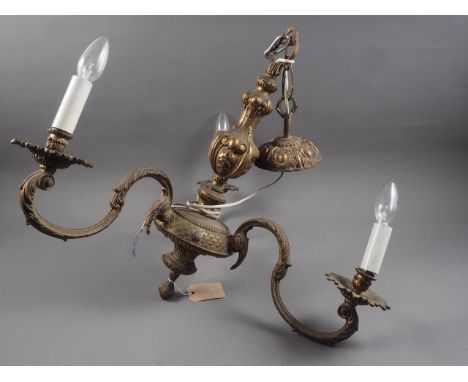 A brass three-branch scroll arm chandelier 